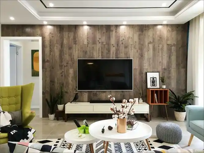 电视墙的深灰色与客厅墙面的明黄色形成反差,更加凸显出电视墙的设计