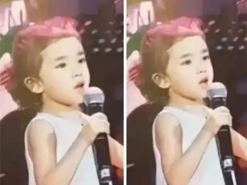 7月17号,小糯米在舞台上表演唱歌的清晰正面照曝光,小手握着话筒的