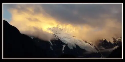 【风云中的金顶摄影图片】梅里雪山 雨崩村风光摄影_太平洋电脑网摄影