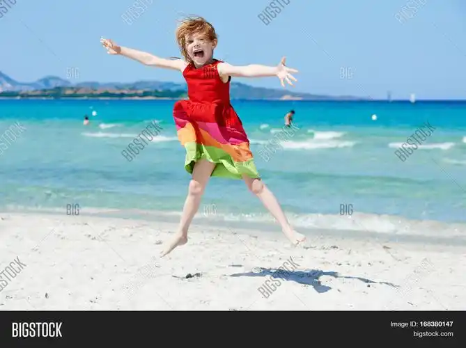 exciting little girl at sea beach